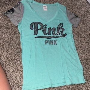 Slightly see through PINK T-shirt. Size small.